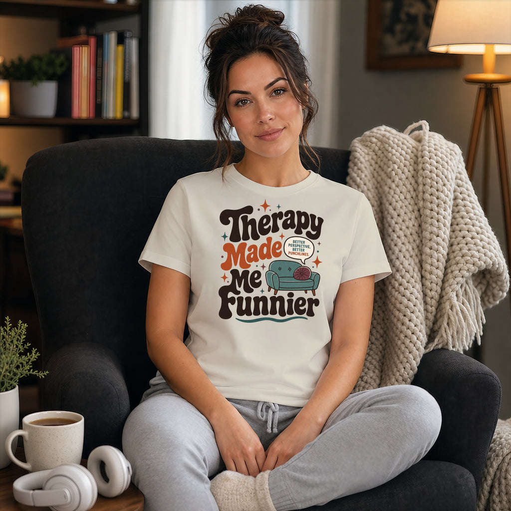 Woman wearing "Therapy Made Me Funnier" t-shirt with couch graphic.