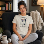Woman in armchair wearing t-shirt with "Tabs Open Inside" graphic.
