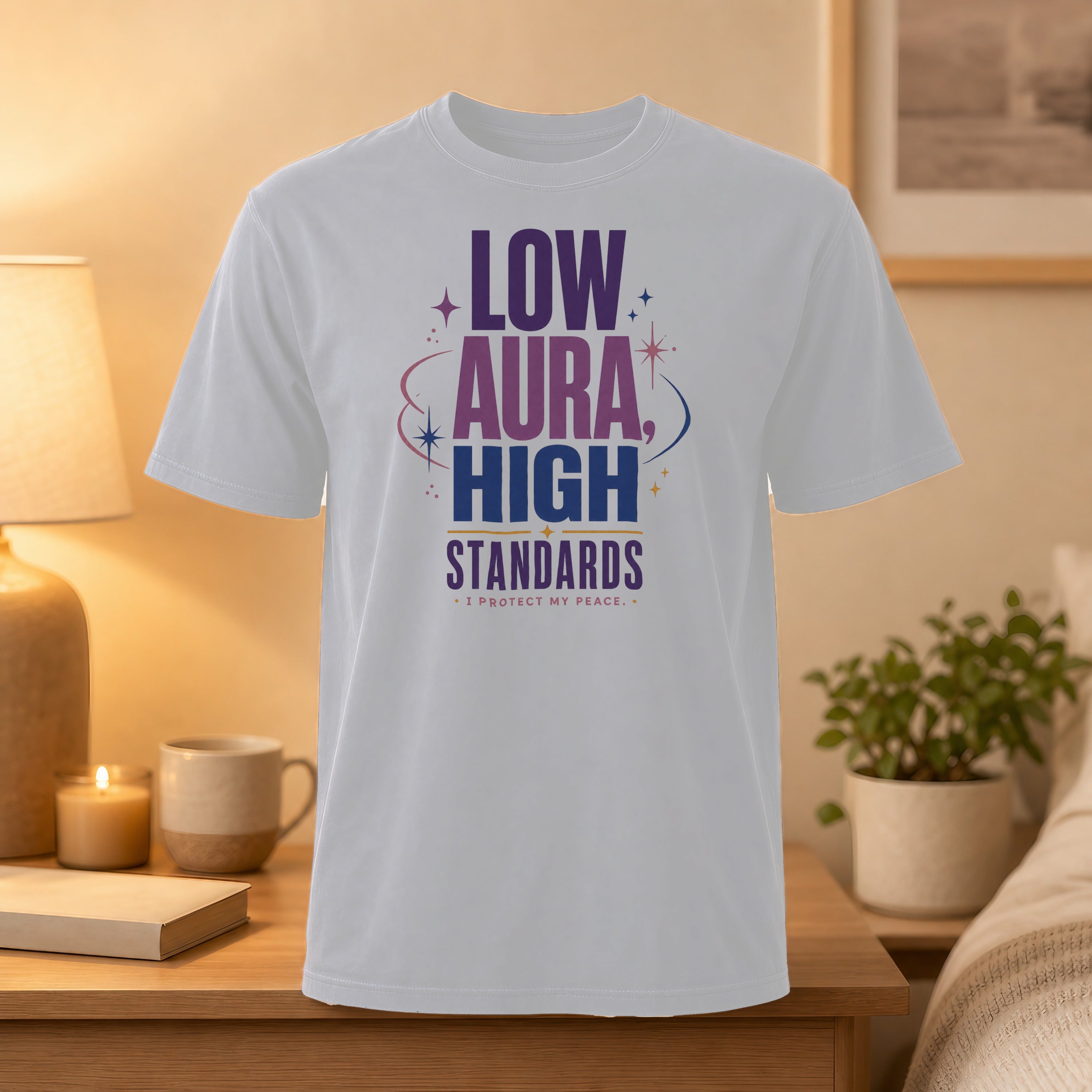 White t-shirt with "LOW AURA HIGH STANDARDS" text.