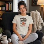 Woman wearing t-shirt with "I'm Fine. It's Fine. Everything's Fine." text and smiling sun graphic.