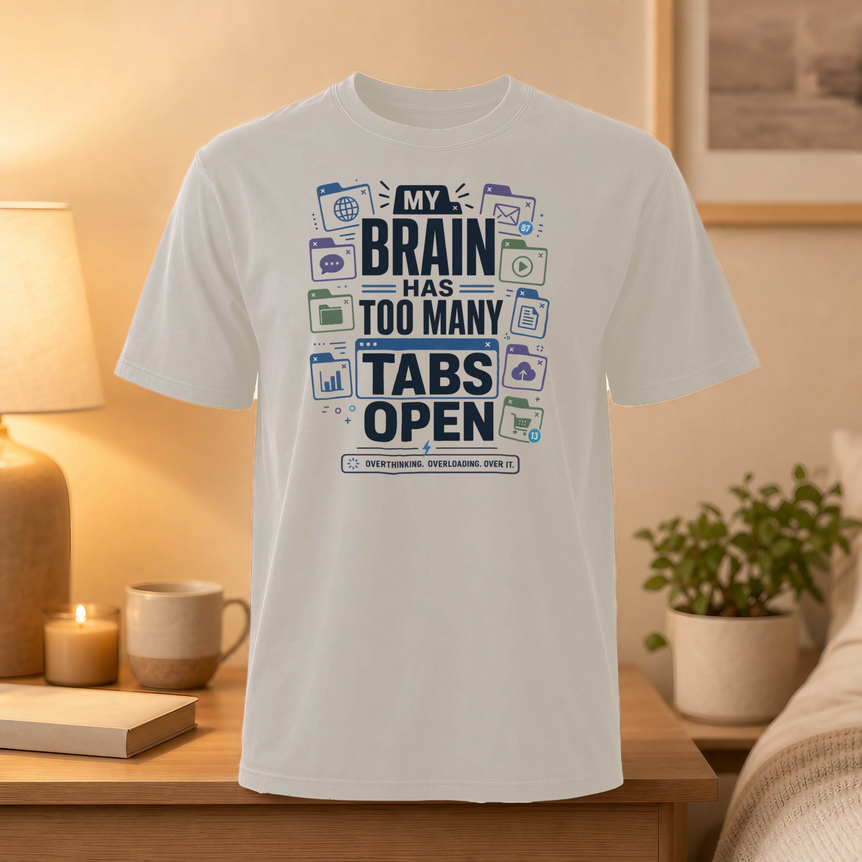 White t-shirt with "My brain has too many tabs open" graphic.