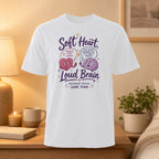 White t-shirt with "Soft Heart, Loud Brain" and illustrated heart and brain.