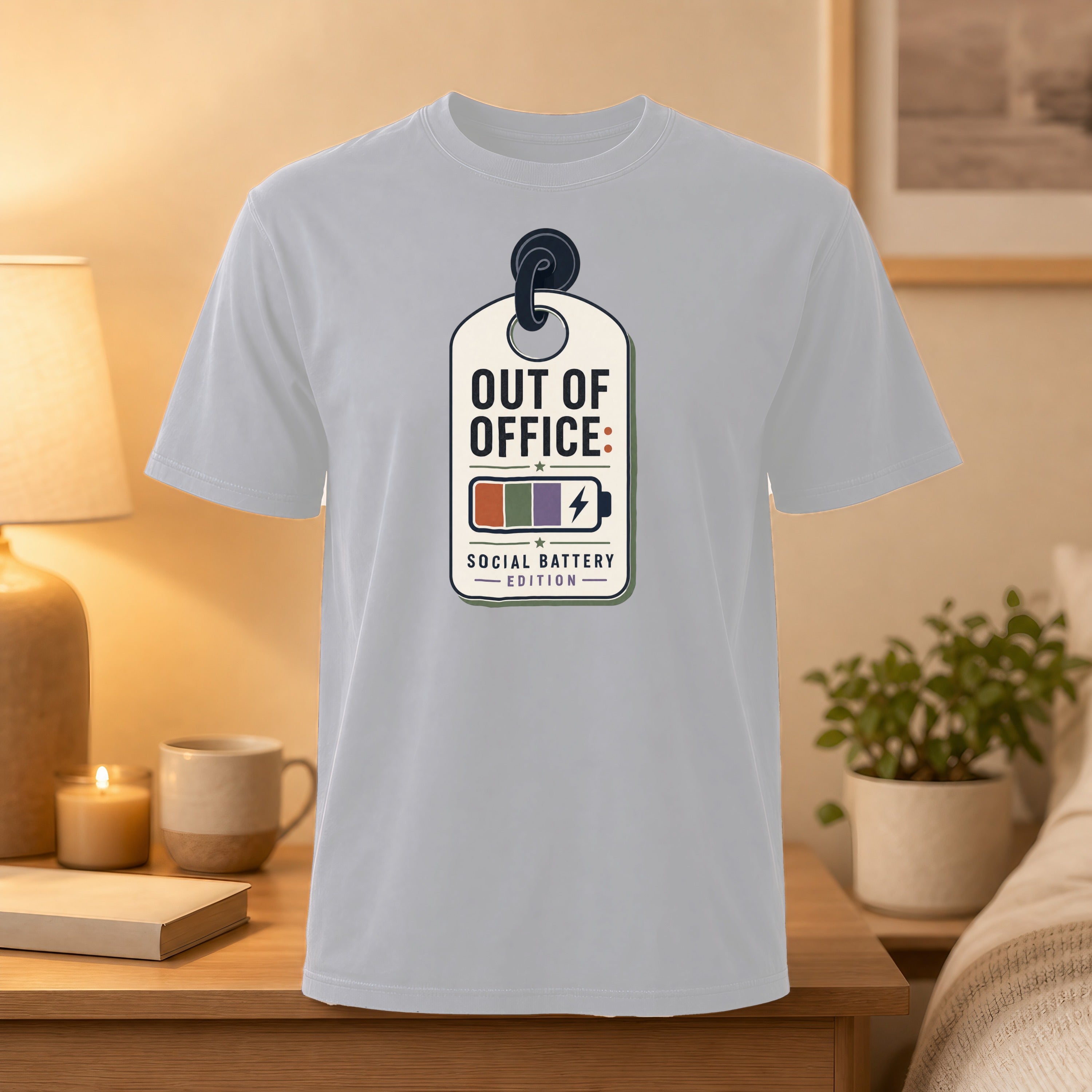 Light gray t-shirt with "Out of Office: Social Battery Edition" tag graphic.