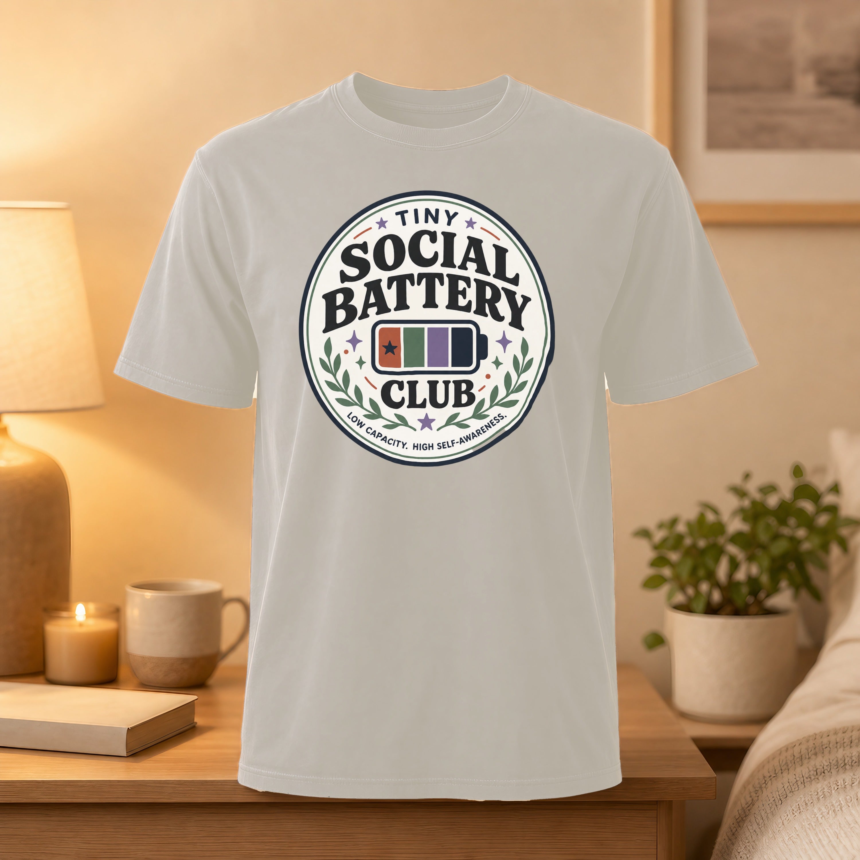 T-shirt with "Tiny Social Battery" and stars in a circular logo.