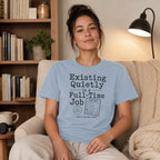 Light blue t-shirt with "Existing Quietly Is A Full-Time Job" and a mock timesheet.