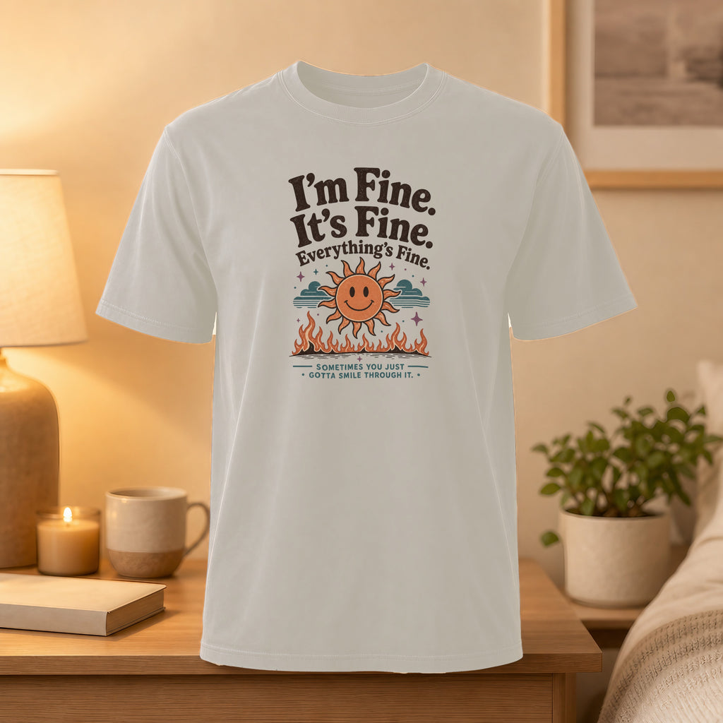 White t-shirt with "I'm Fine. It's Fine. Everything's Fine." and smiling sun graphic.