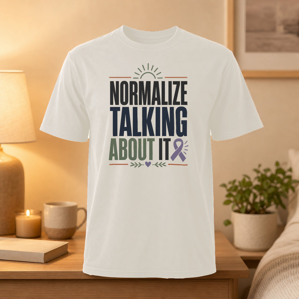 White t-shirt with "Normalize Talking About It" text and purple ribbon.