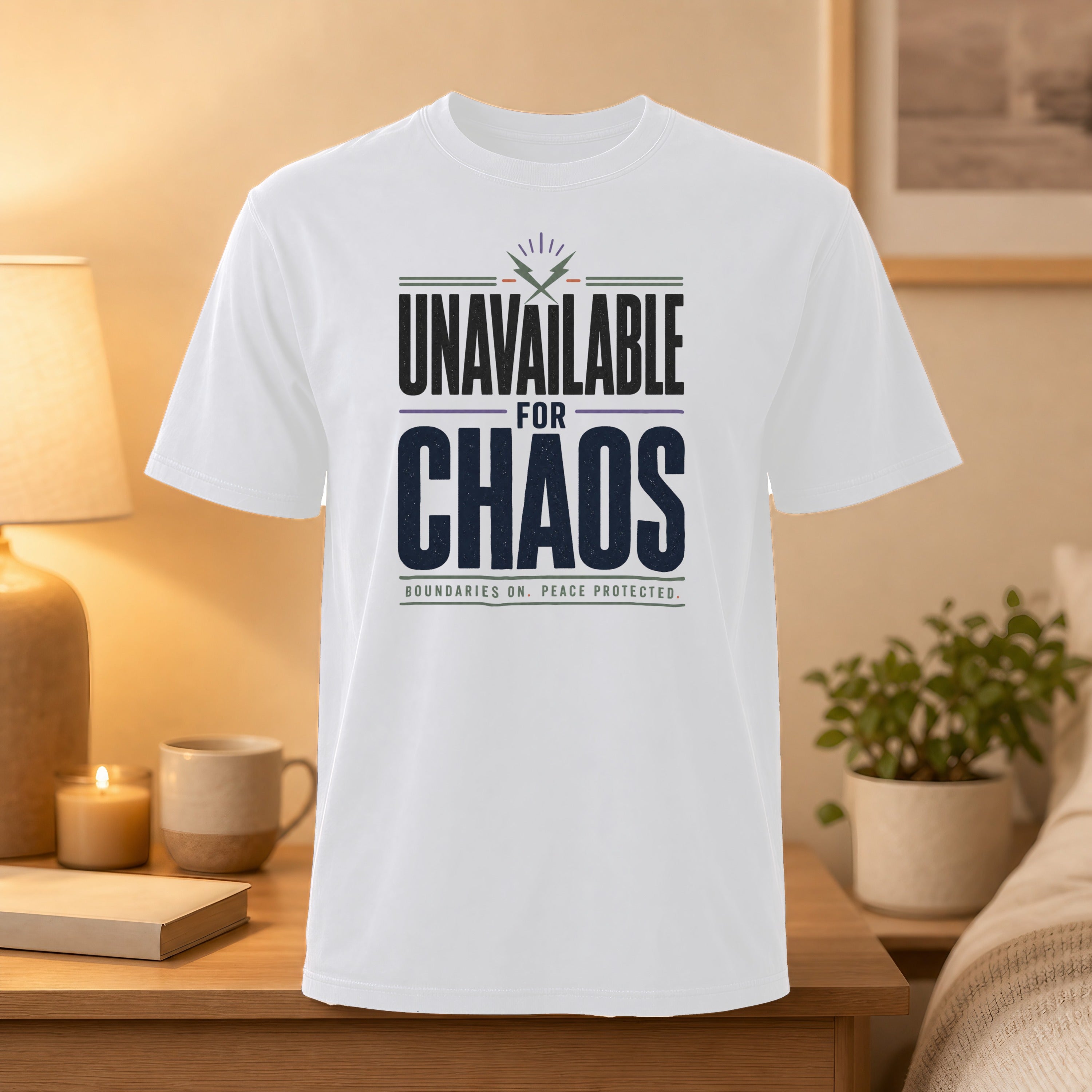 White t-shirt with "Unavailable for Chaos" text and graphic.