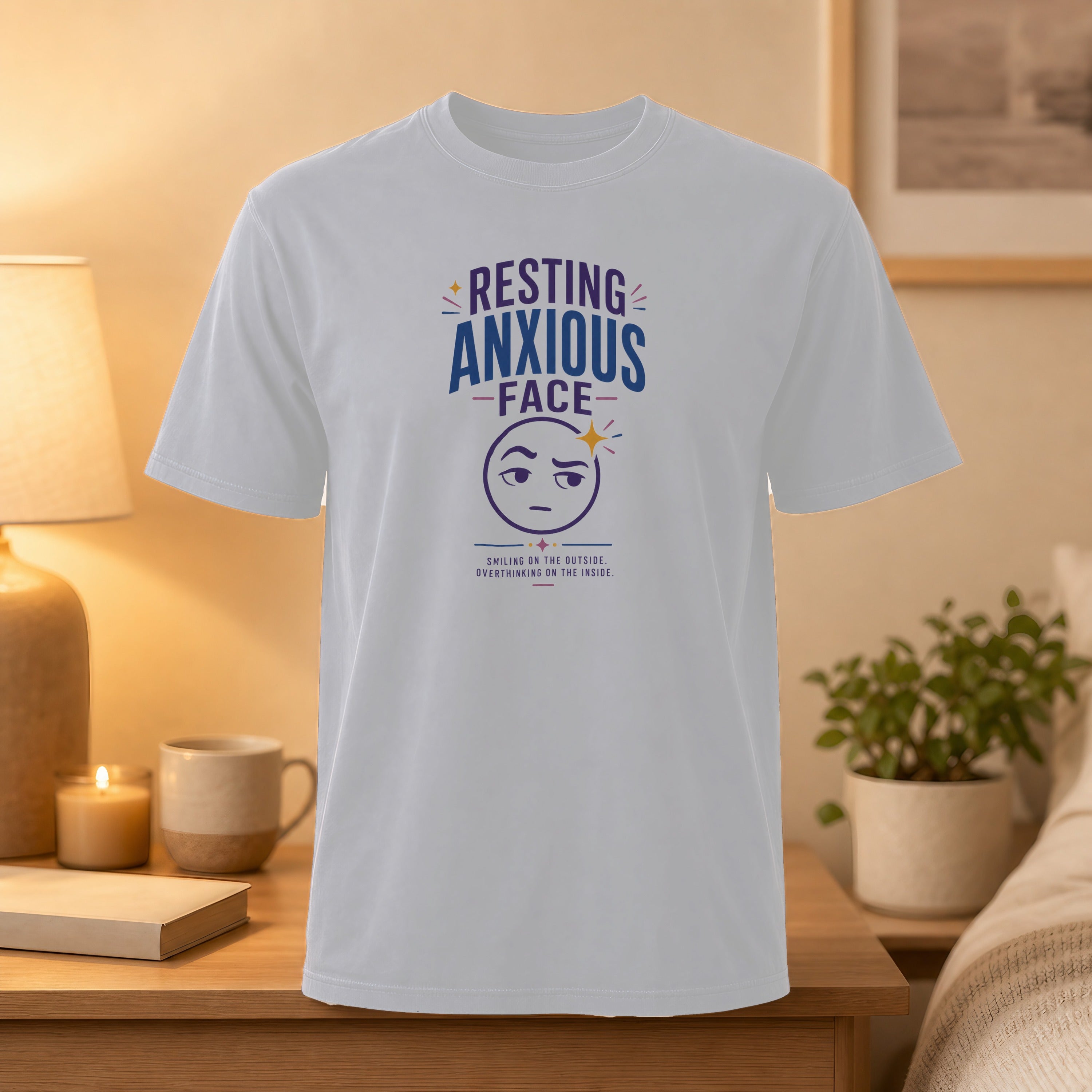 White t-shirt with "Resting Anxious Face" graphic and text.