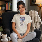 Woman wearing a cream t-shirt with "Resting Anxious Face" text and graphic.