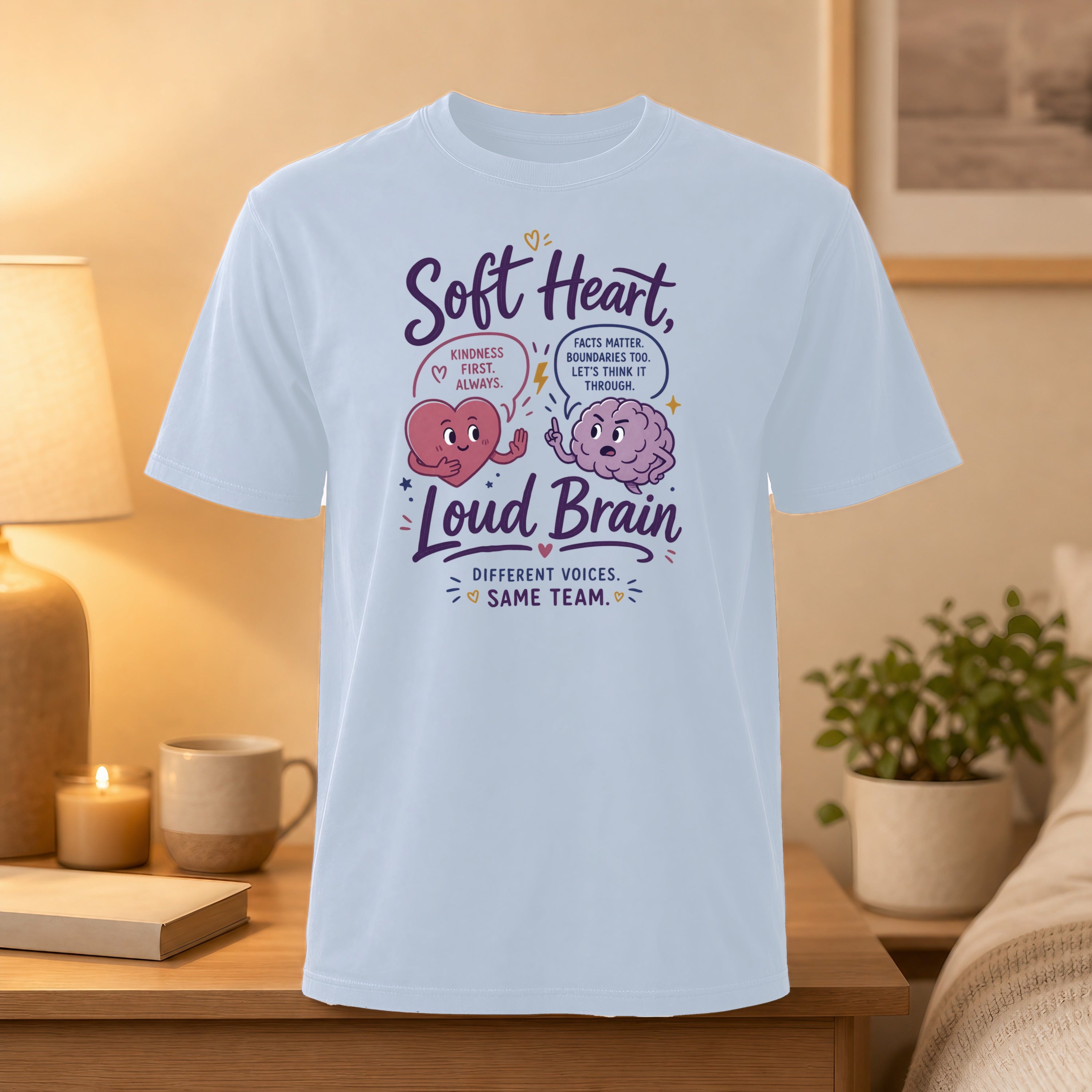 Light blue t-shirt with "Soft Heart, Loud Brain" text and illustrations.