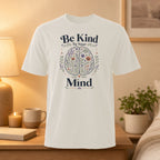 White t-shirt with "Be Kind To Your Mind" text and floral brain graphic.