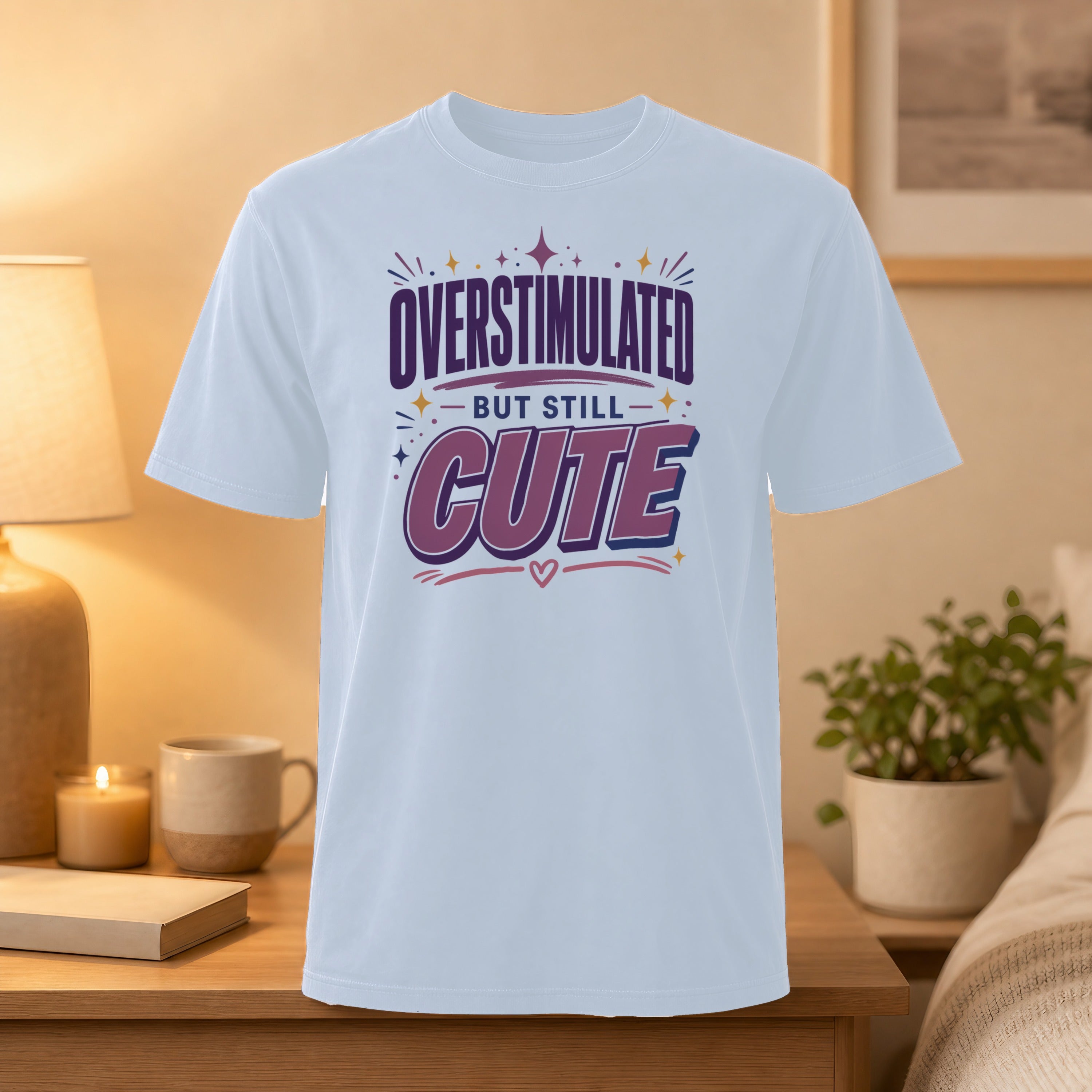 White t-shirt with "Overstimulated but still cute" text and heart graphic.