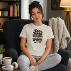 Woman in a cream t-shirt with "Too Many Thoughts Not Enough Snacks" text.