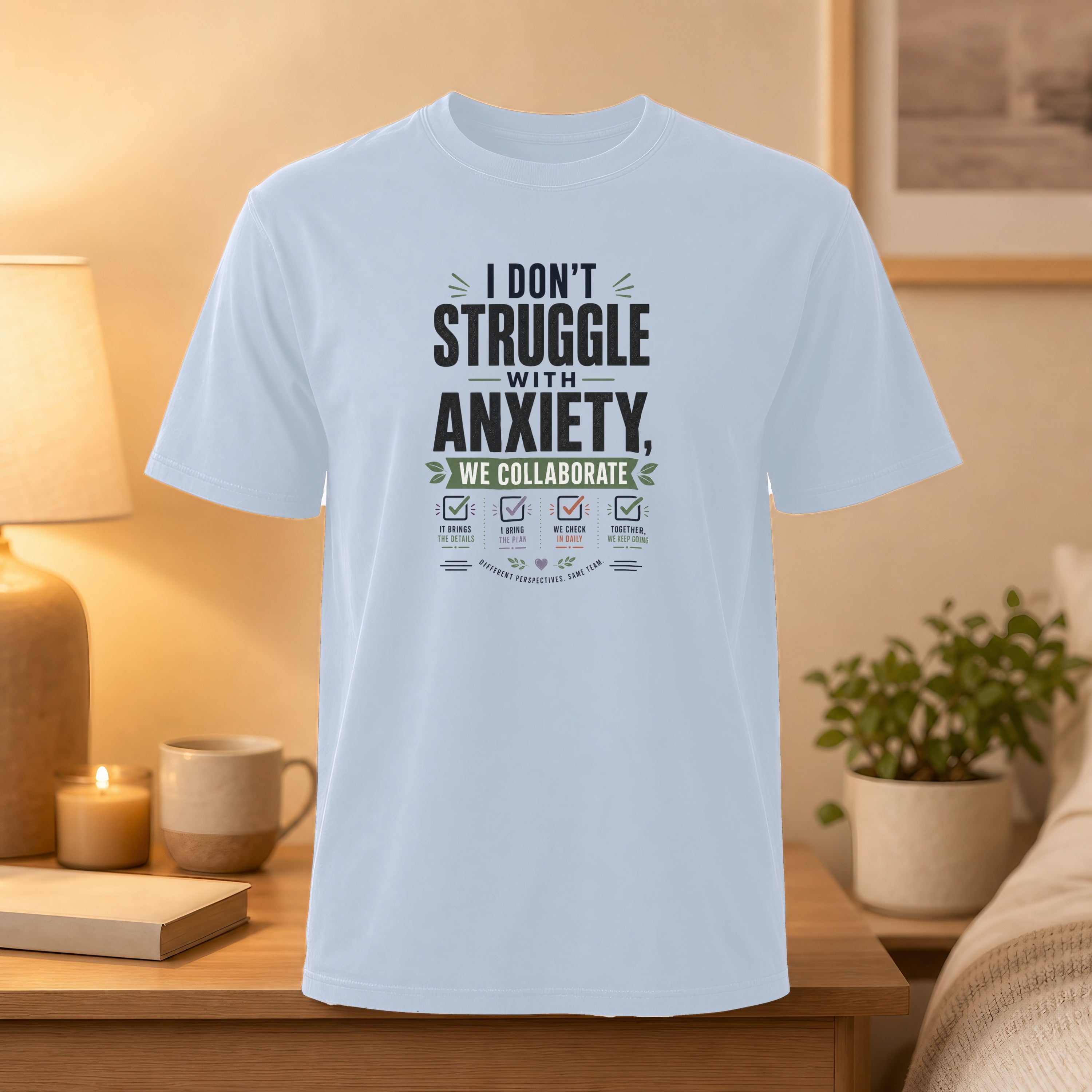 White t-shirt with "I Don't Struggle With Anxiety" and collaboration list.