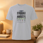 White t-shirt with "I Don't Struggle With Anxiety" text and collaboration graphic.