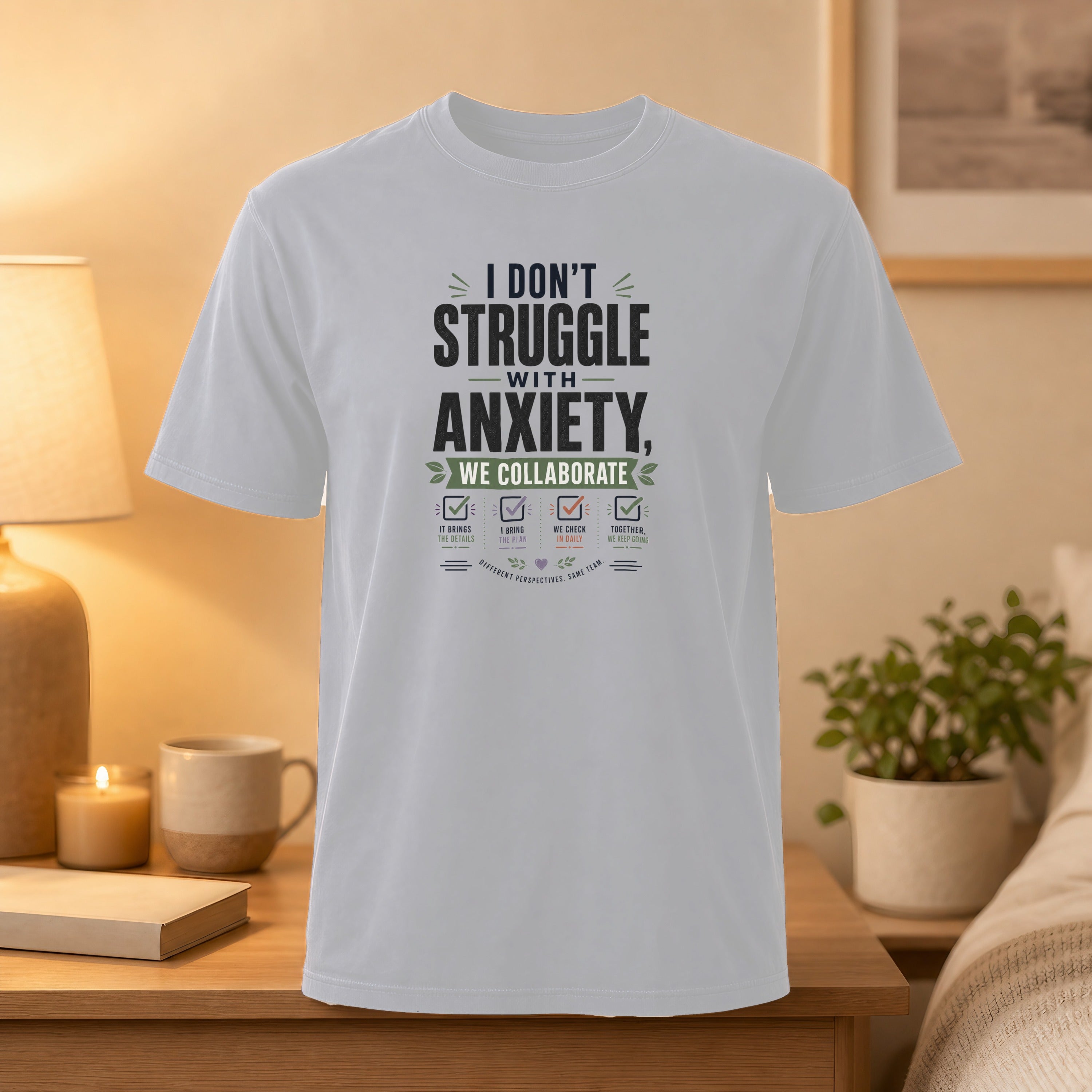 White t-shirt with "I Don't Struggle With Anxiety" text and collaboration graphic.