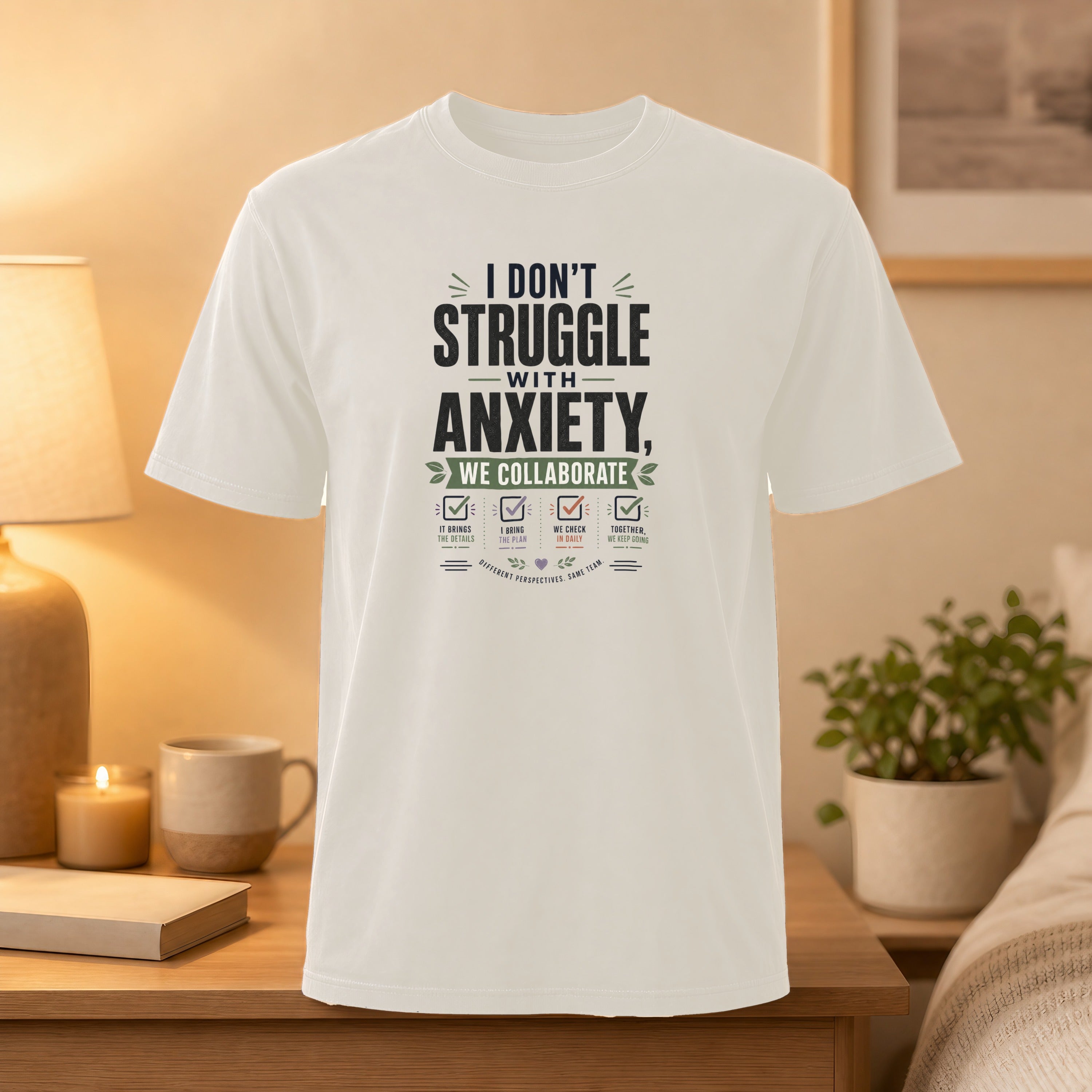 White t-shirt with "I Don't Struggle With Anxiety, We Collaborate" graphic.