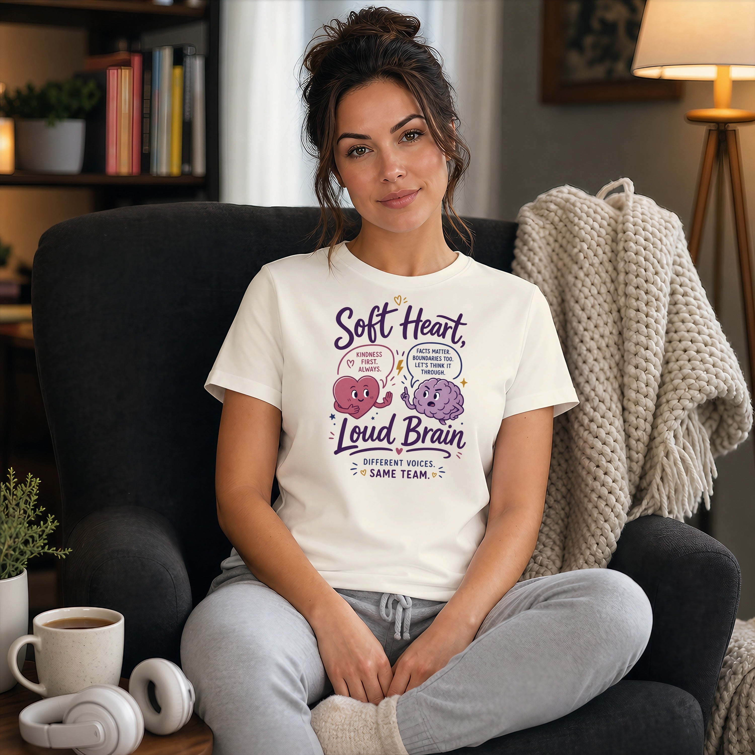 Woman in t-shirt with "Soft Heart, Loud Brain" text and brain graphic.