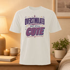 White t-shirt with "Overstimulated But Still Cute" graphic.