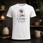 White t-shirt with a floral design and "Gentle, Not Available" text.