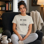 Woman wearing a cream t-shirt with black text that reads "Not rude, just regulating".