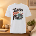 White t-shirt with "Therapy Made Me Funnier" text and couch graphic.