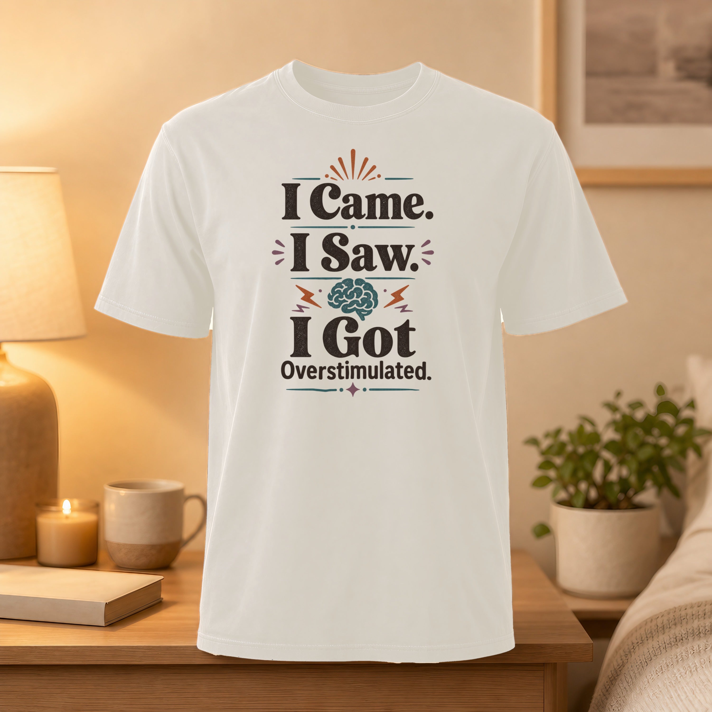 White t-shirt with "I Came. I Saw. I Got Overstimulated." text and brain graphic.