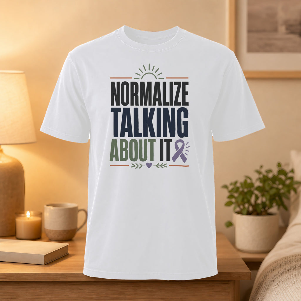 White t-shirt with "Normalize Talking About It" text and purple ribbon.