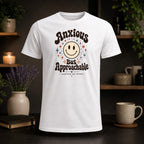 White t-shirt with "Anxious But Approachable" text and a retro smiley face.