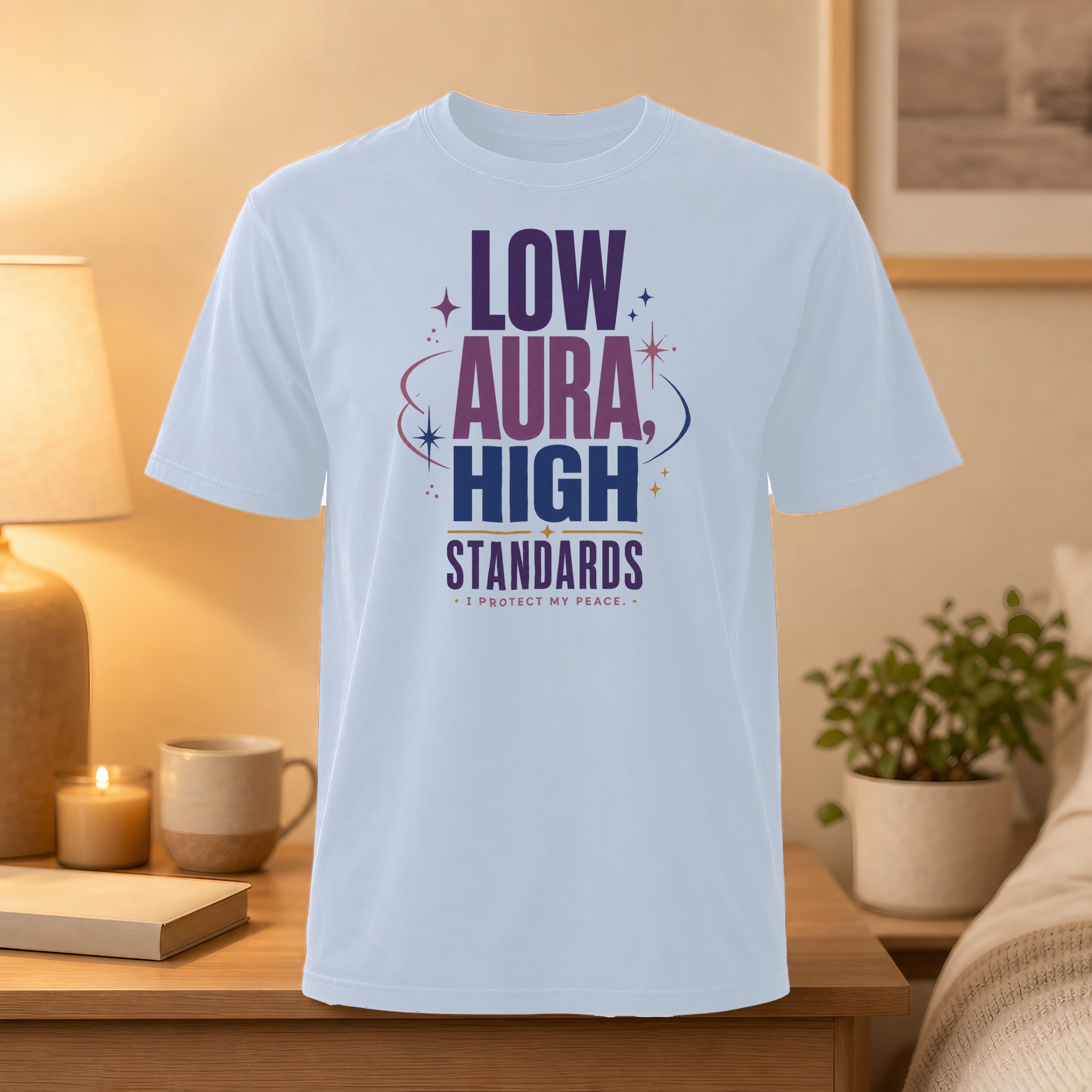 White t-shirt with "LOW AURA HIGH STANDARDS I PROTECT MY PEACE" text.