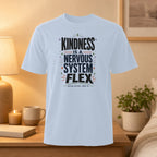 Light blue t-shirt with "Kindness is a Nervous System Flex" text and graphic.