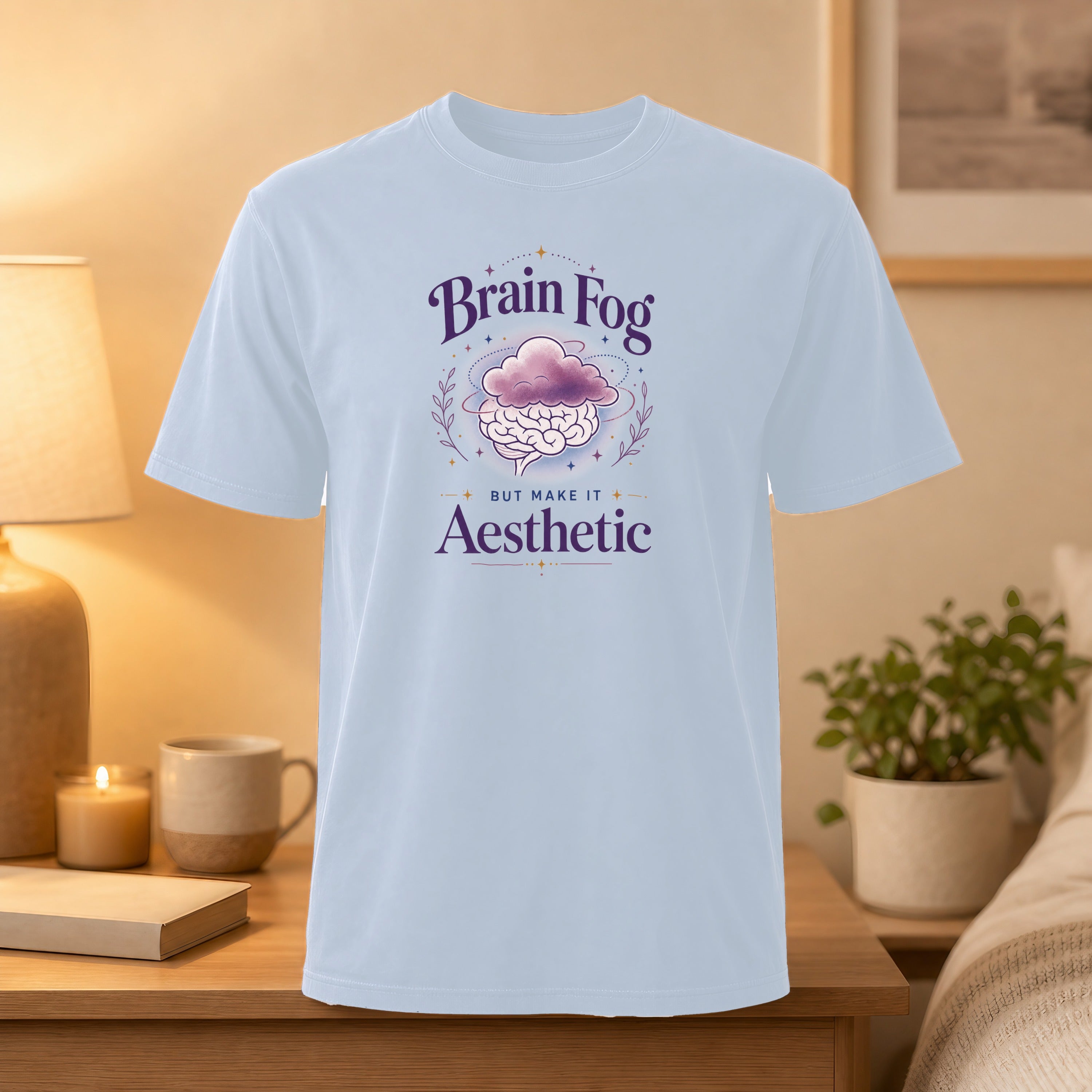 Light blue t-shirt with "Brain Fog BUT MAKE IT Aesthetic" text and cloud graphic.