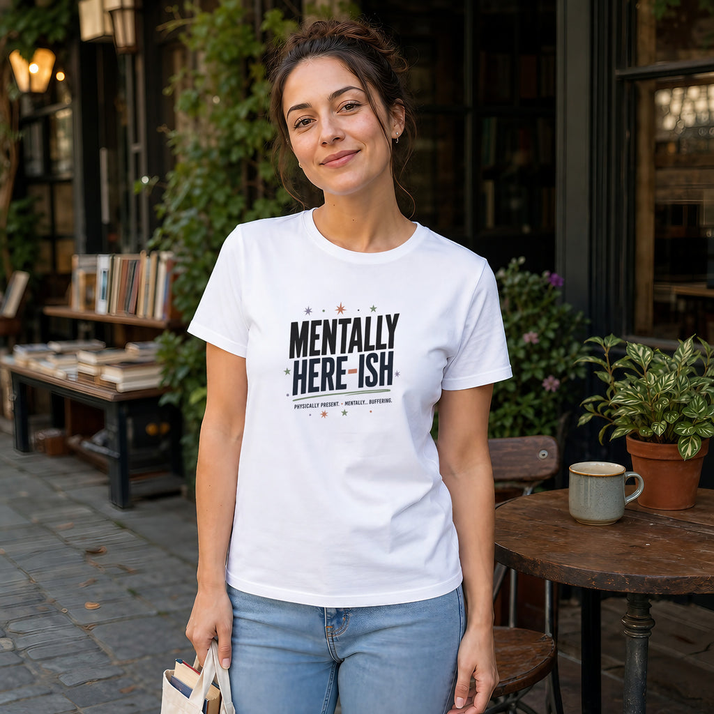 Woman wearing a white t-shirt with text "Mentally Here-ish"