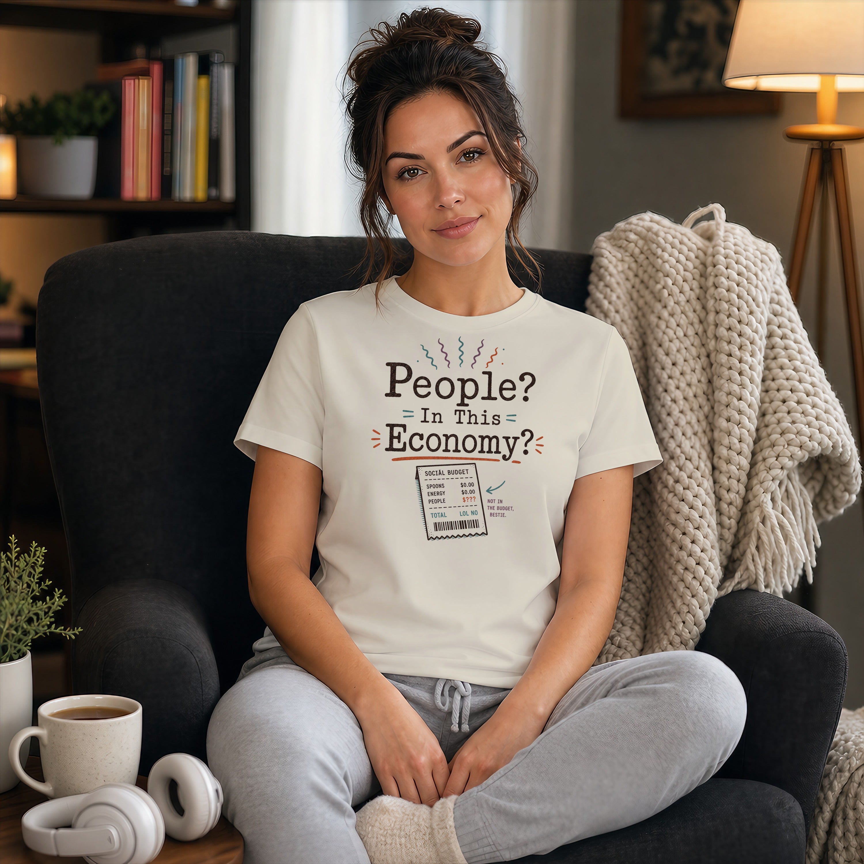 Woman in a t-shirt with "People? In This Economy?" text and a budget list.