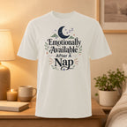 White t-shirt with "Emotionally Available After A Nap" text and moon graphic.
