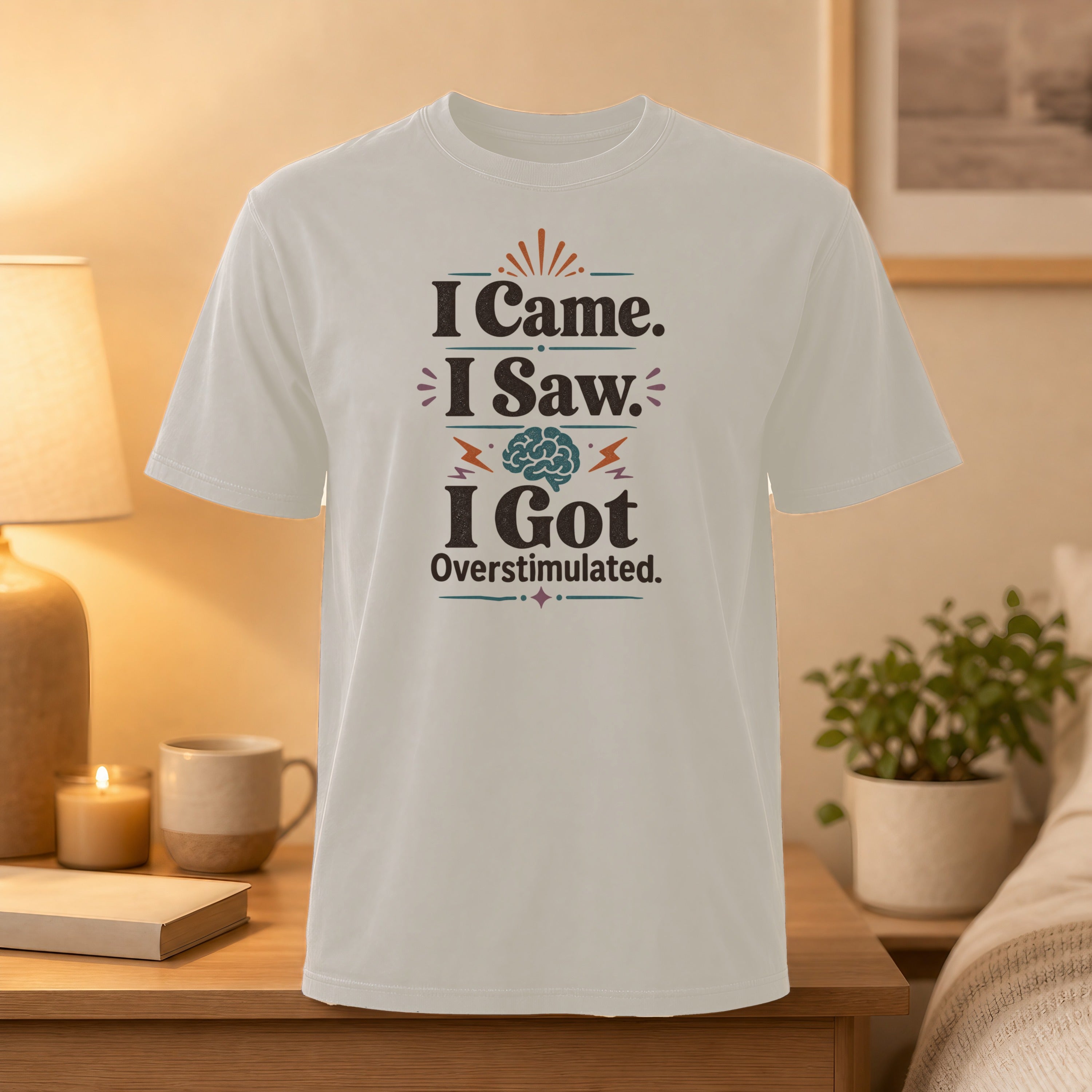 White t-shirt with "I Came. I Saw. I Got Overstimulated." text and brain graphic.