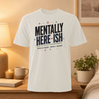 White t-shirt with "Mentally Here-ish" and "Physically Present. Mentally... Buffering." text.