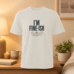 White t-shirt with "I'M FINE-ISH" and "SOME DAYS ARE JUST A LITTLE MORE CREATIVE" text.