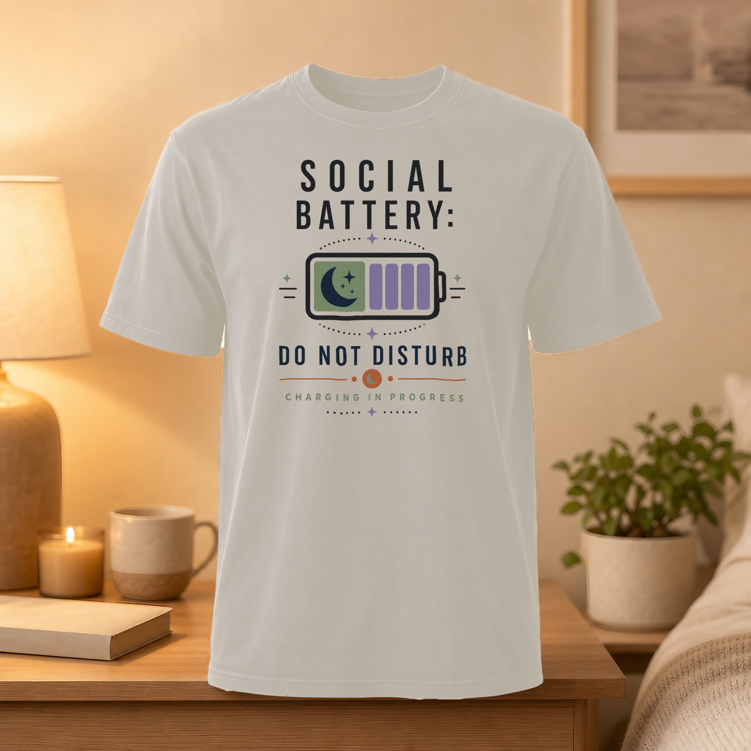 White t-shirt with "Social Battery: Charging In Progress" and moon icon.