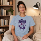 Light blue t-shirt with "My Aura Left The Chat" text and celestial graphics.