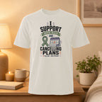 White t-shirt with "Support Mental Health and Cancelling Plans" text and ribbon.