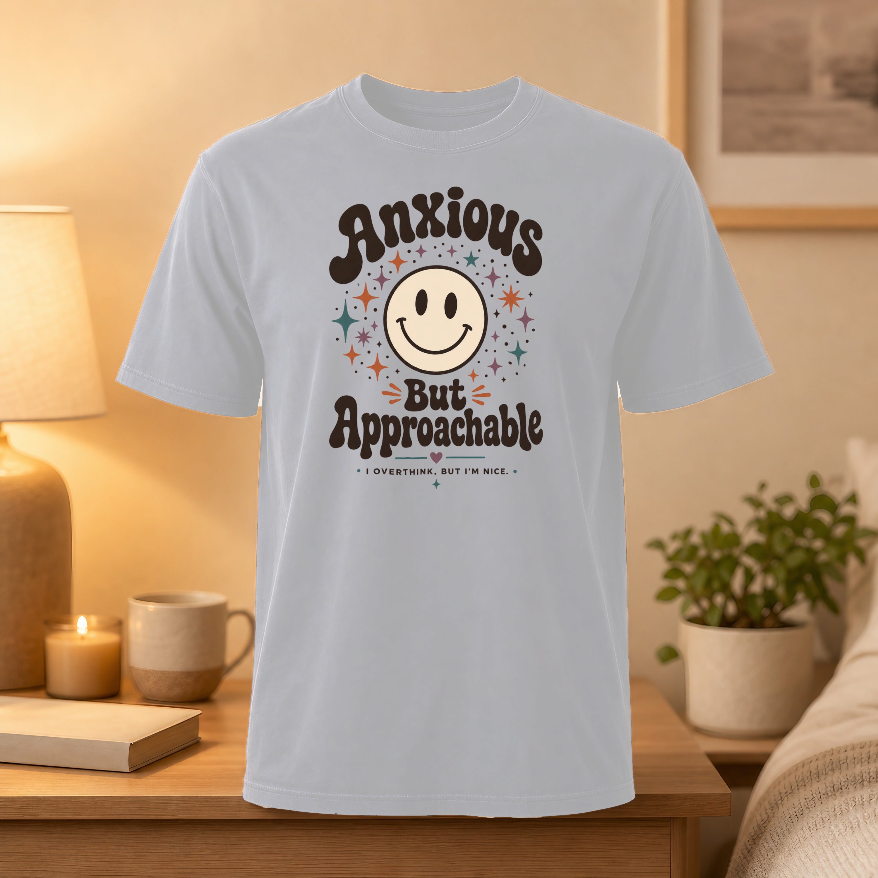 Light gray t-shirt with "Anxious But Approachable" text and a smiling star graphic.