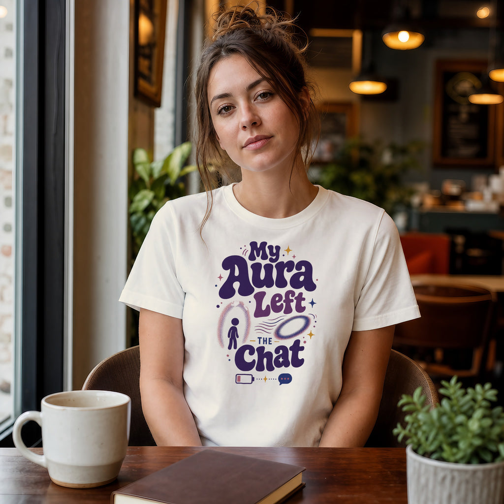 Woman wearing a white t-shirt with "My Aura Left the Chat" text and graphic.