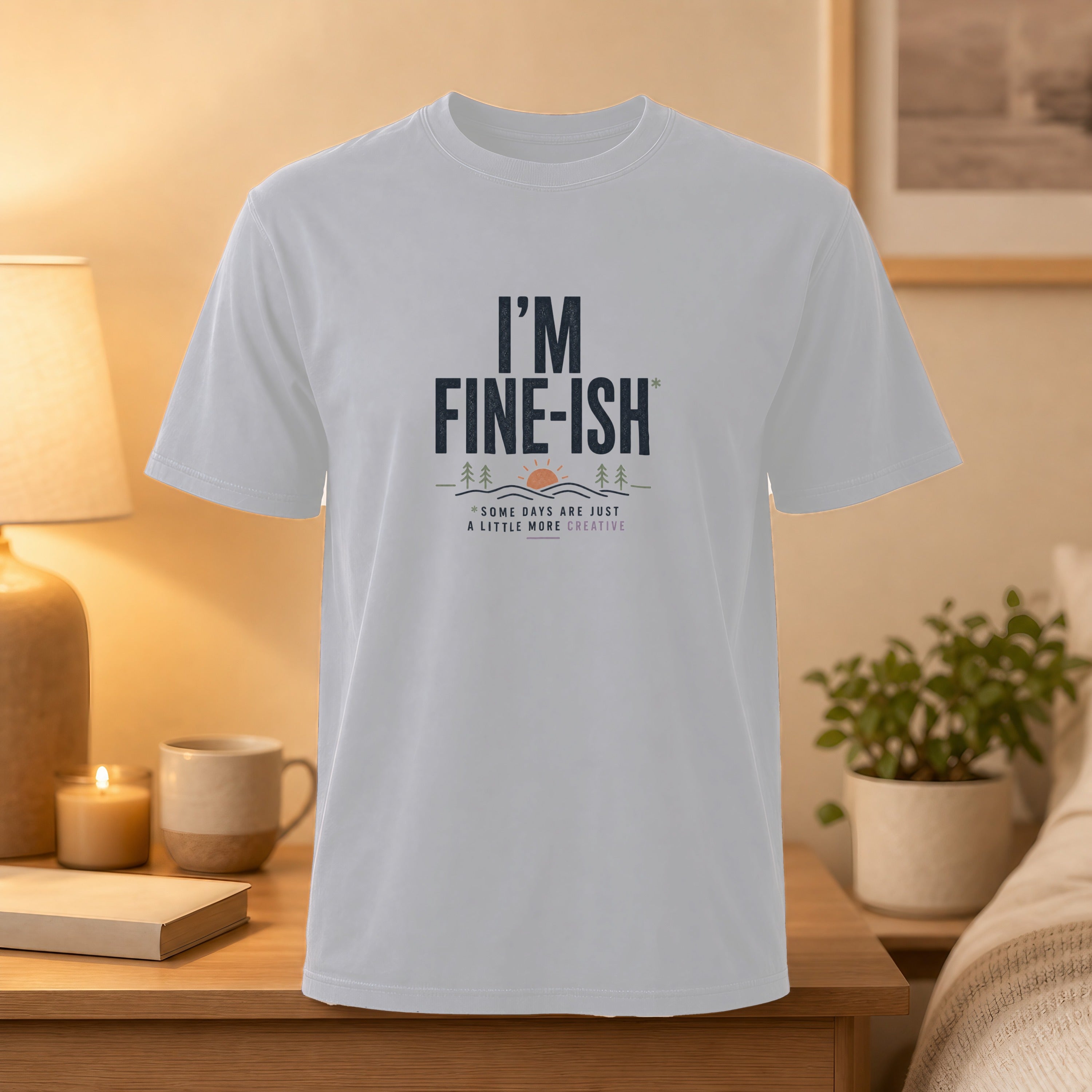 White t-shirt with "I'M FINE-ISH" and creative nature graphic.