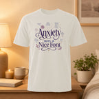White t-shirt with "Anxiety With A Nice Font" and related text.