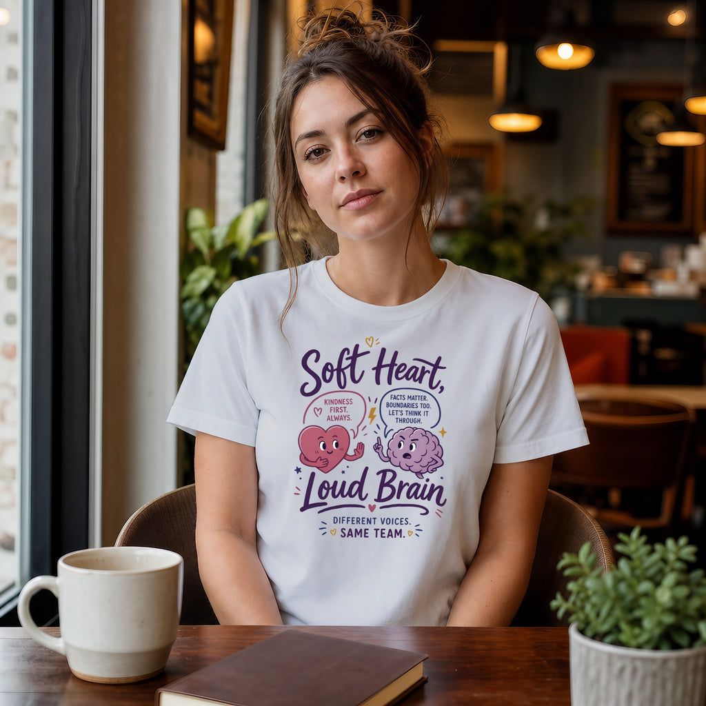 White t-shirt with "Soft Heart, Loud Brain" text and graphic.