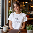 Woman in white t-shirt with "Healing, but make it sarcastic" text.