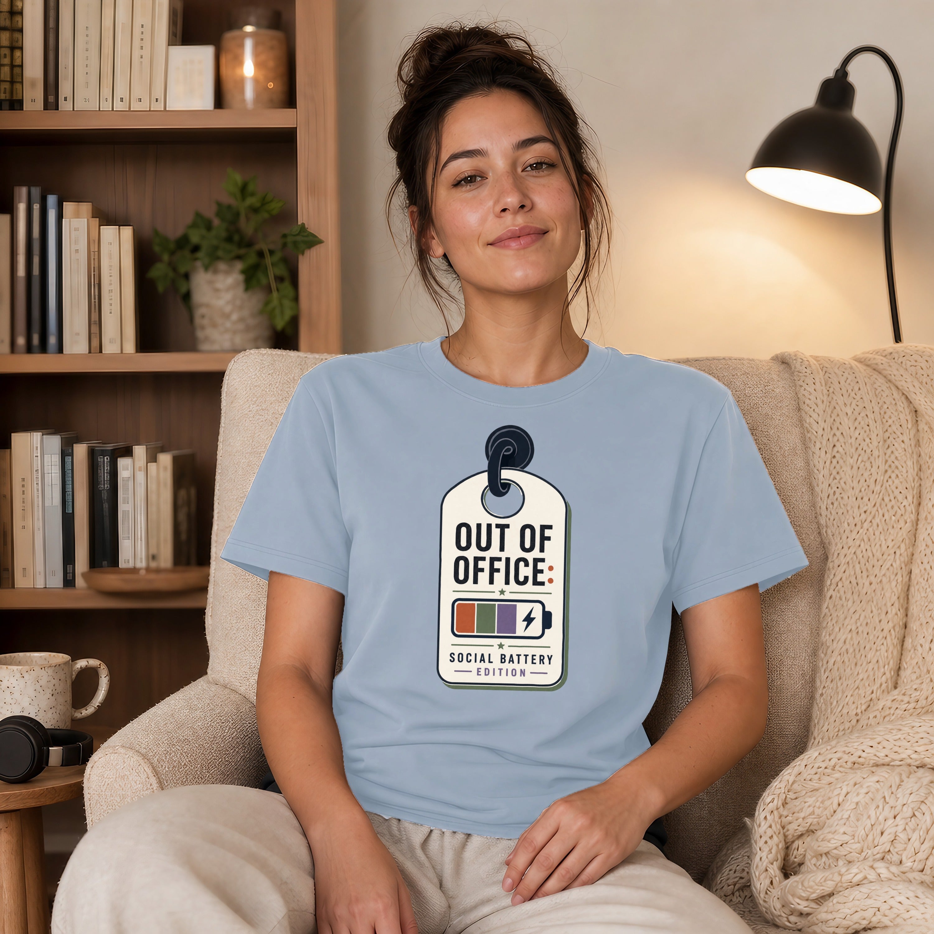 Light blue t-shirt with "Out of Office: Social Battery Edition" tag graphic.