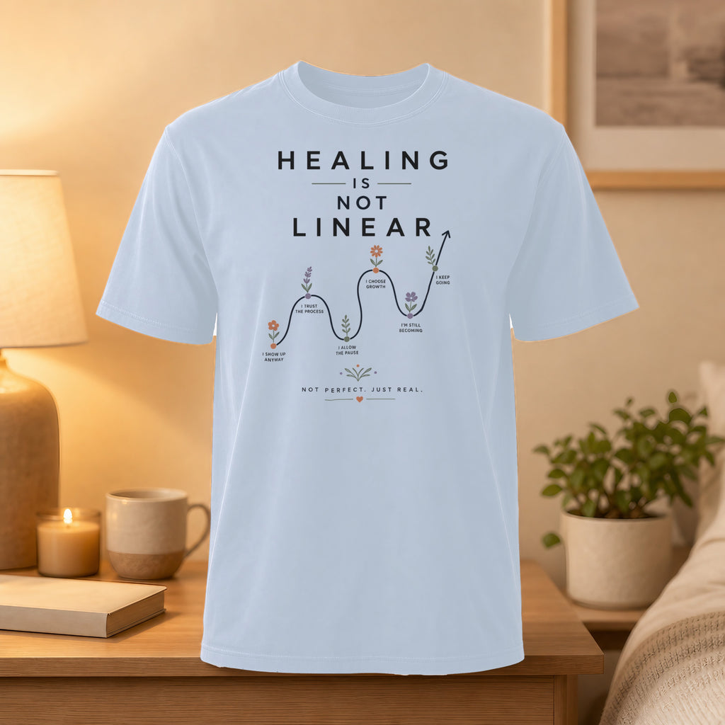 T-shirt with "HEALING IS NOT LINEAR" and growth stages graphic.
